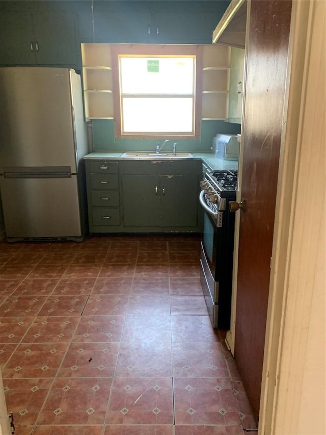 kitchen with appliances with stainless steel finishes, open shelves, and a sink