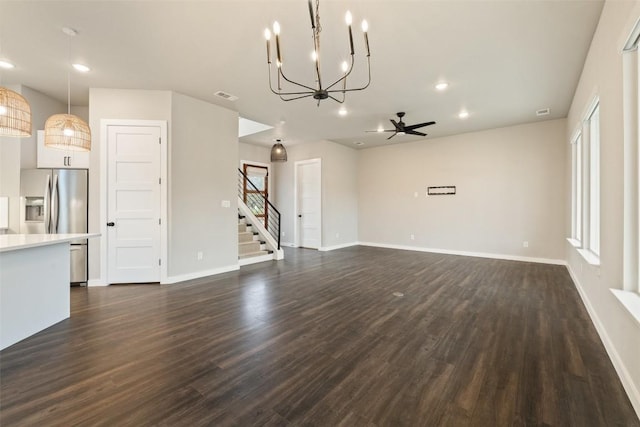 unfurnished living room with recessed lighting, visible vents, dark wood-type flooring, ceiling fan, and baseboards