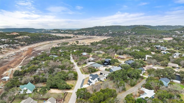 18200 Fair Ln, Jonestown, TX 78645 - aerial overview of property's location with mountains and nearby suburban area