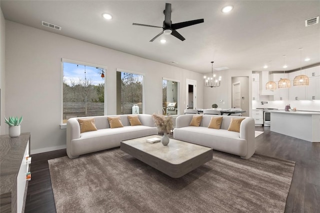 18200 Fair Ln, Jonestown, TX 78645 - living room with a ceiling fan, a chandelier, dark wood finished floors, recessed lighting, and baseboards