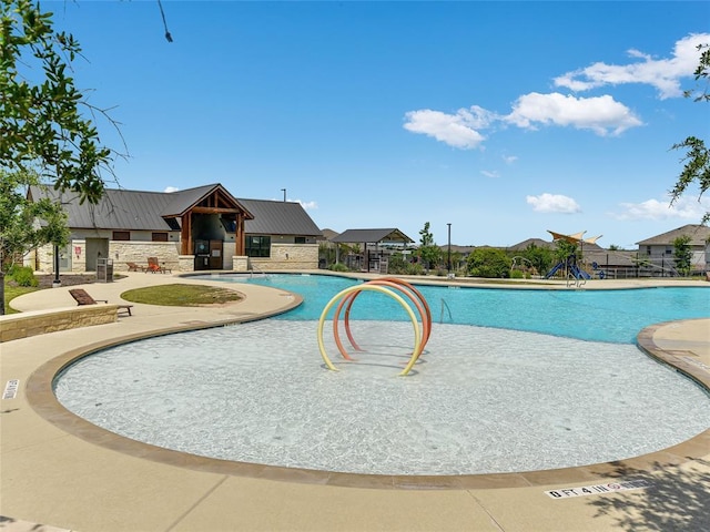 community pool with a patio area