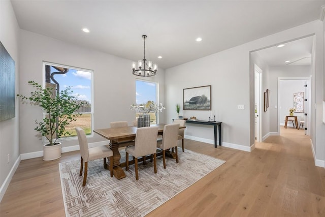 dining area featuring light wood-type flooring, baseboards, and recessed lighting