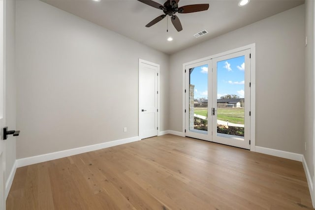 unfurnished room with french doors, recessed lighting, visible vents, light wood-style floors, and baseboards