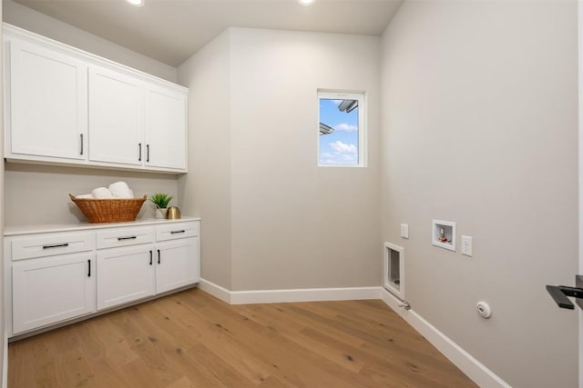 washroom with gas dryer hookup, hookup for a washing machine, baseboards, cabinet space, and light wood finished floors