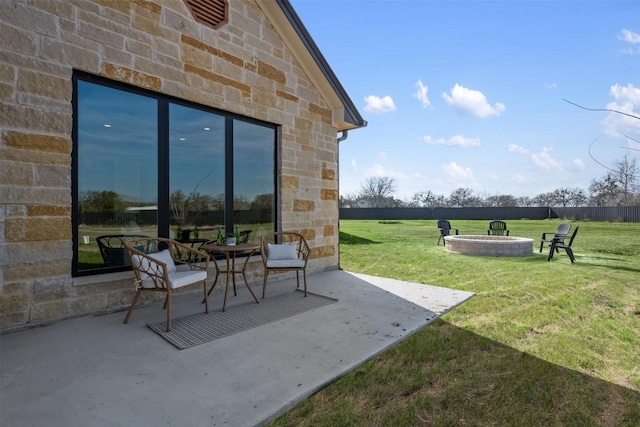 view of patio / terrace featuring an outdoor fire pit and fence