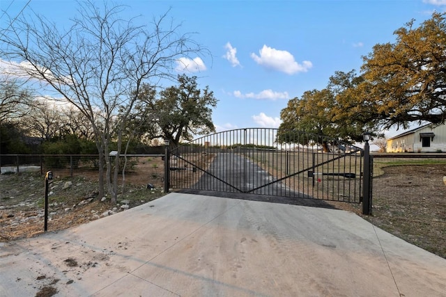 view of gate with fence