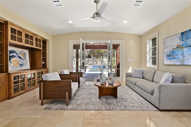 living room with a ceiling fan, recessed lighting, visible vents, and vaulted ceiling