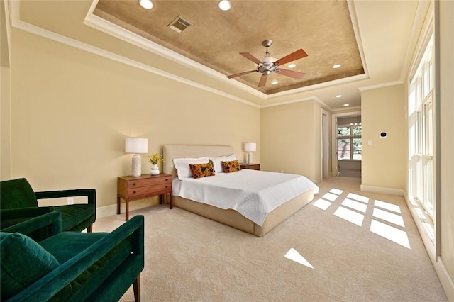 carpeted bedroom featuring ornamental molding, recessed lighting, and a raised ceiling