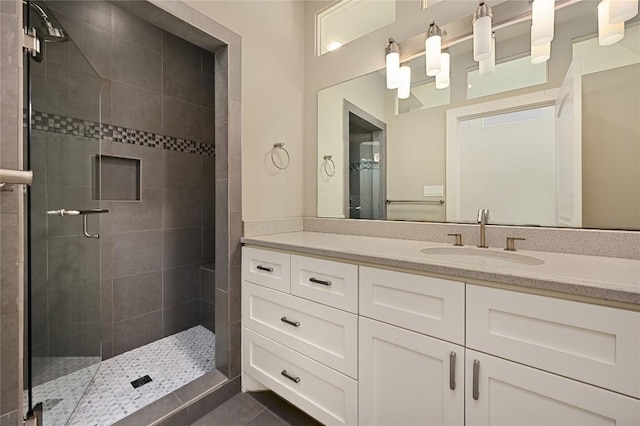 full bath featuring a shower stall and vanity