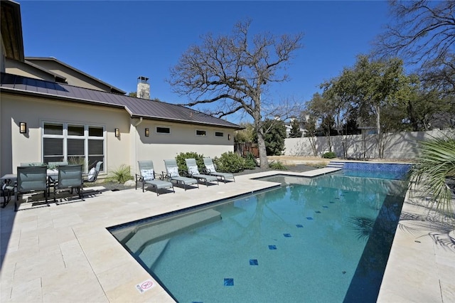 view of swimming pool featuring a patio area, a fenced backyard, and a fenced in pool