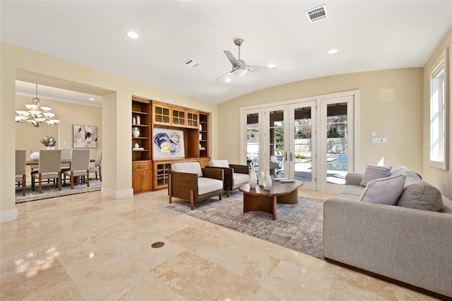 living room with recessed lighting, ceiling fan with notable chandelier, visible vents, baseboards, and vaulted ceiling