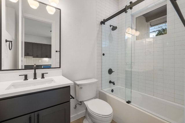 bathroom featuring bathing tub / shower combination, toilet, and vanity