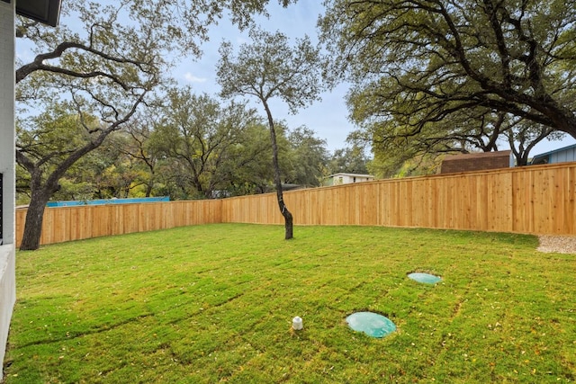 view of yard featuring a fenced backyard