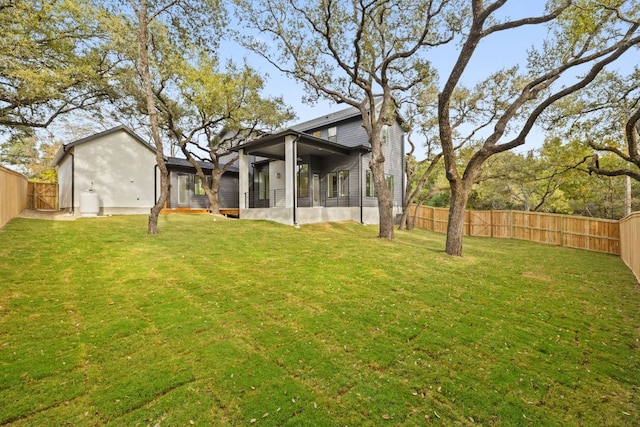 view of yard featuring a fenced backyard