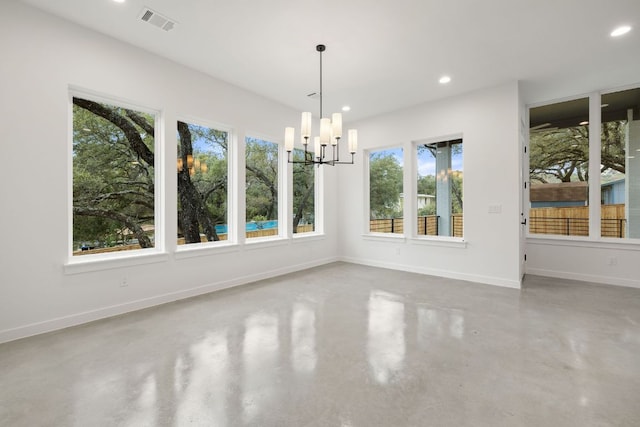 unfurnished dining area with concrete flooring, a chandelier, recessed lighting, visible vents, and baseboards