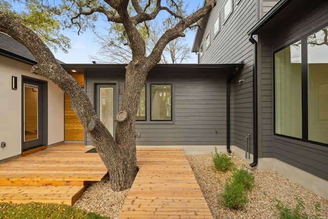 doorway to property featuring a wooden deck