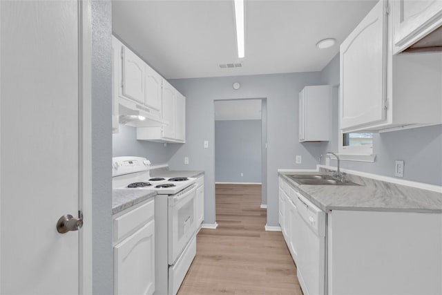 kitchen with under cabinet range hood, white appliances, a sink, white cabinetry, and visible vents