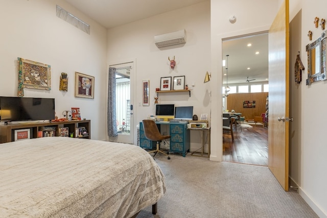 carpeted bedroom featuring a wall mounted air conditioner and recessed lighting