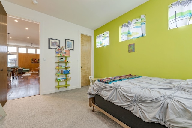 bedroom featuring ensuite bathroom, carpet floors, and recessed lighting