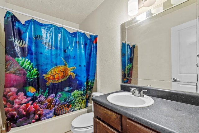 bathroom featuring a textured wall, toilet, shower / tub combo, a textured ceiling, and vanity