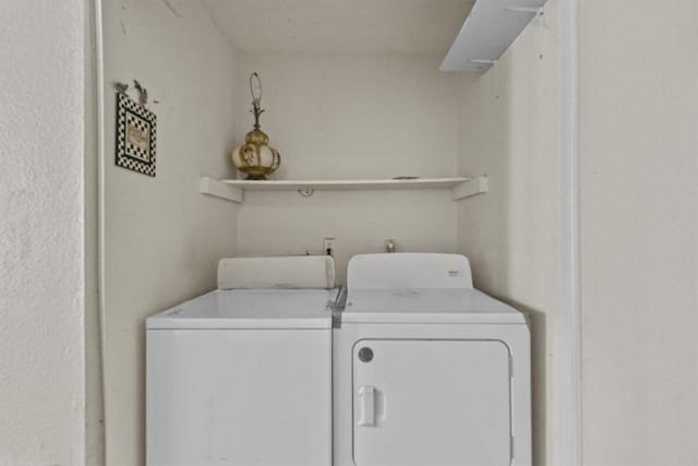 laundry room featuring laundry area and washing machine and dryer