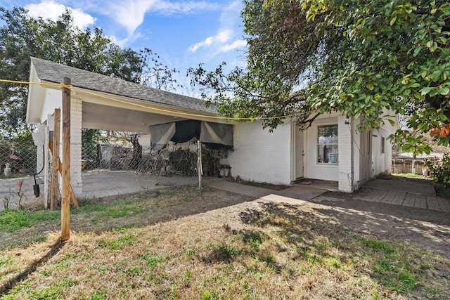 view of front of house featuring fence