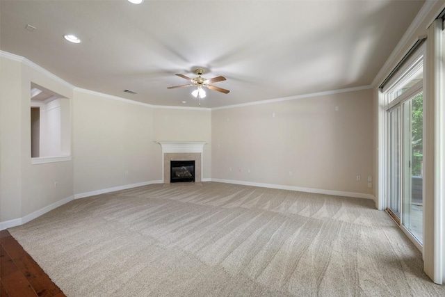 unfurnished living room with ornamental molding, a fireplace, and baseboards