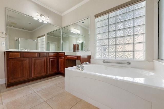 bathroom featuring crown molding, a stall shower, vanity, tile patterned flooring, and a bath