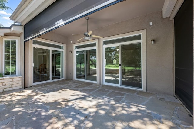 view of patio featuring ceiling fan