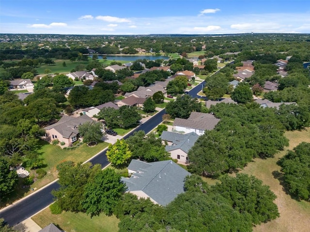 birds eye view of property with a residential view and a water view