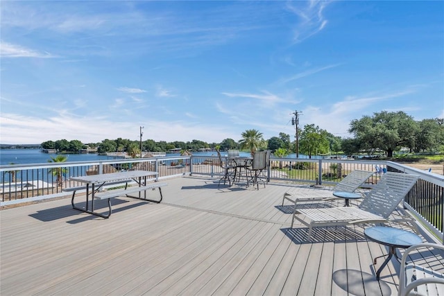 wooden deck featuring a water view