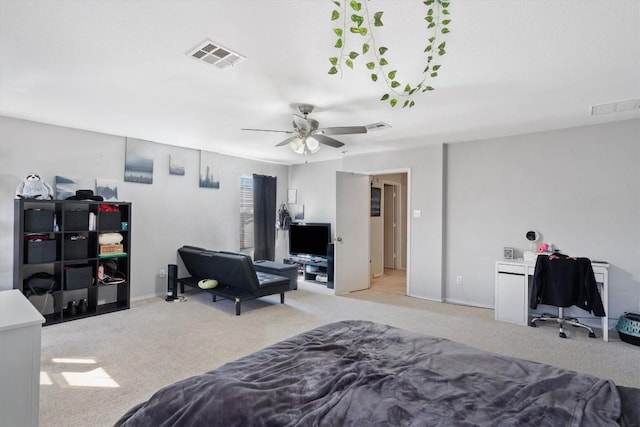 bedroom with a ceiling fan, visible vents, and light colored carpet