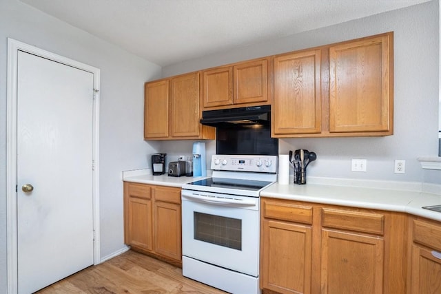 2112 Perkins Pl, Georgetown, TX 78626 - kitchen featuring white range with electric stovetop, ventilation hood, light wood-style flooring, and light countertops