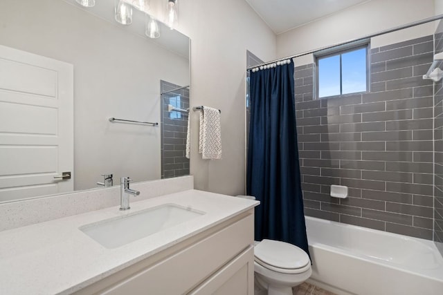 full bathroom featuring toilet, shower / bath combo, and vanity