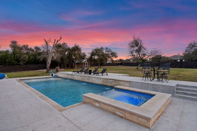 view of pool featuring a patio area, a fenced backyard, an in ground hot tub, and a yard