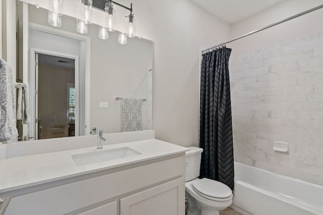 bathroom featuring shower / bath combination with curtain, vanity, and toilet