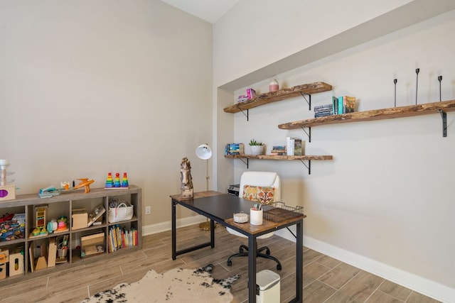 office space featuring baseboards and wood tiled floor