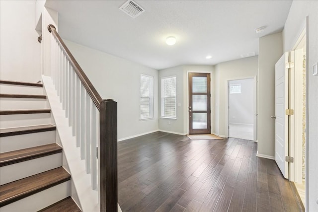 10204 Jacksboro Trl, Austin, TX 78717 - foyer featuring stairway, dark wood-style floors, and baseboards