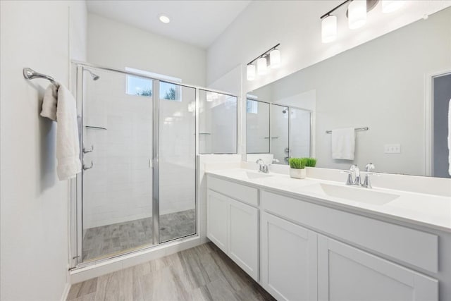 10204 Jacksboro Trl, Austin, TX 78717 - full bathroom with double vanity, a shower stall, and recessed lighting