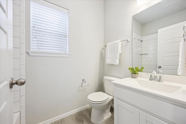10204 Jacksboro Trl, Austin, TX 78717 - bathroom with vanity, toilet, wood finished floors, a shower, and baseboards