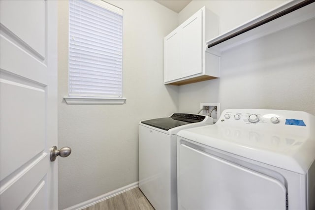 10204 Jacksboro Trl, Austin, TX 78717 - laundry area with washing machine and dryer, cabinet space, light wood-style floors, and baseboards