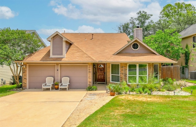 view of front of property with a garage, concrete driveway, cooling unit, brick siding, and a chimney