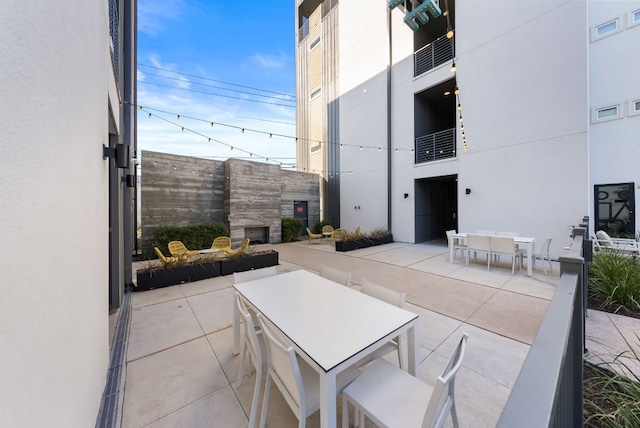 view of patio / terrace with fence, visible vents, and outdoor dining space