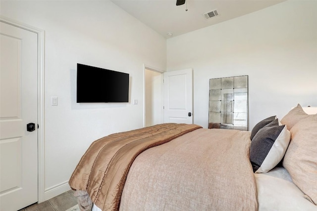 bedroom with visible vents, ceiling fan, and baseboards