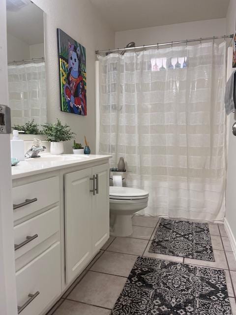 full bath with tile patterned flooring, a shower with shower curtain, vanity, and toilet