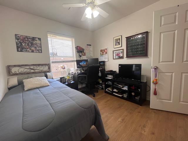 bedroom featuring ceiling fan and wood finished floors