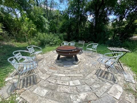 view of patio with an outdoor fire pit