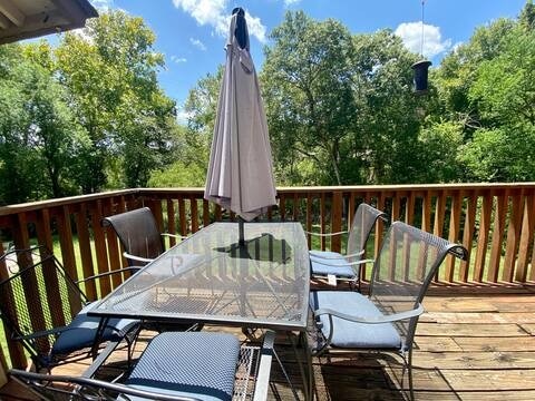 deck with outdoor dining area