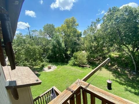 view of yard featuring an outdoor fire pit