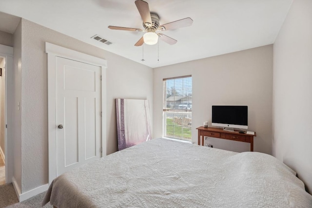 12810 Irongate Ave, Austin, TX 78727 - carpeted bedroom with baseboards and a ceiling fan